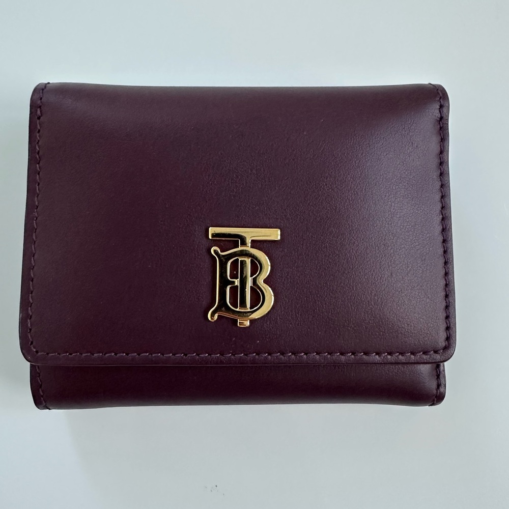Brand new Burberry wallet .color burgundy.made in Italy.with dust bag